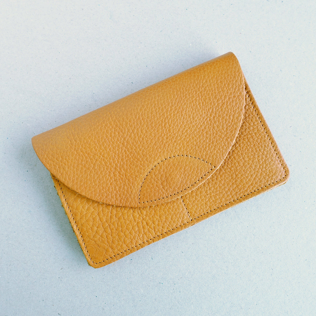yellow leather wallet with round flap